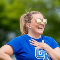A player smiles wearing sunglasses and a GV Lakers shirt